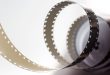 roll of film unwinding across a grey background for sites like 123 movies article